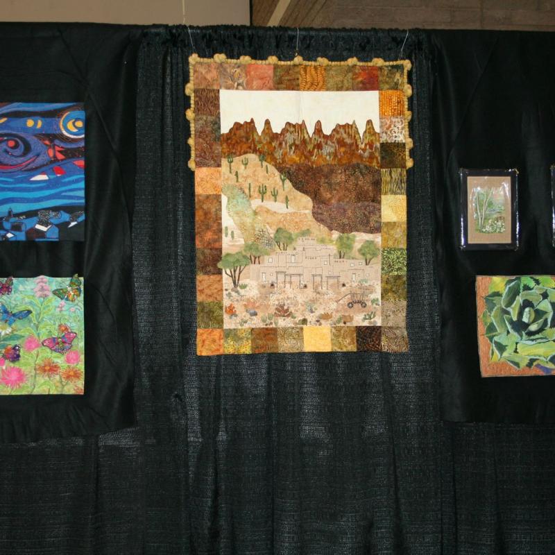 SAQA Booth, SAQA-AZ member artwork at the Tucson Quilt Fiesta, 2020, Tucson Convention Center, Tucson, AZ