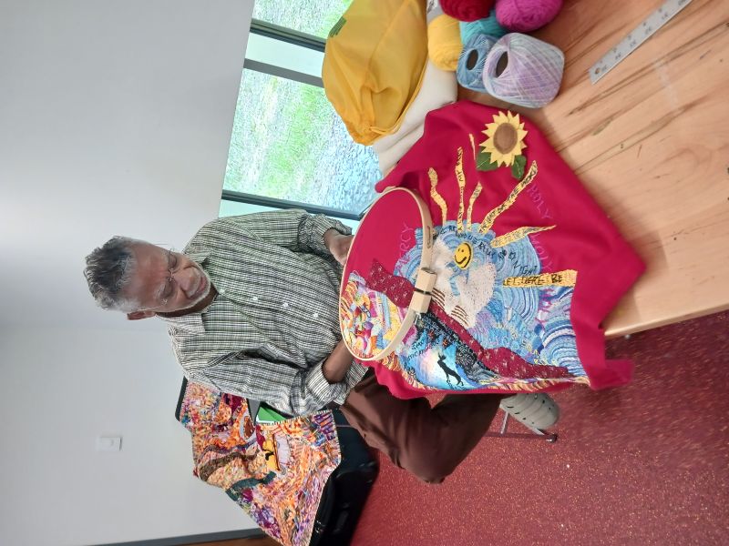 Joe Mallard working on a quilt