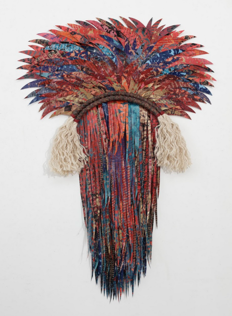 Artwork by Deborah Kruger (via raleighnc.gov) (an abstract fiber sculpture in reds and blues. It evokes the plumage of a bird)