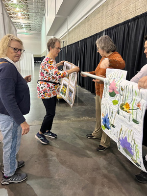 Hanging an exhibit at the Mid-Atlantic Quilt Festival