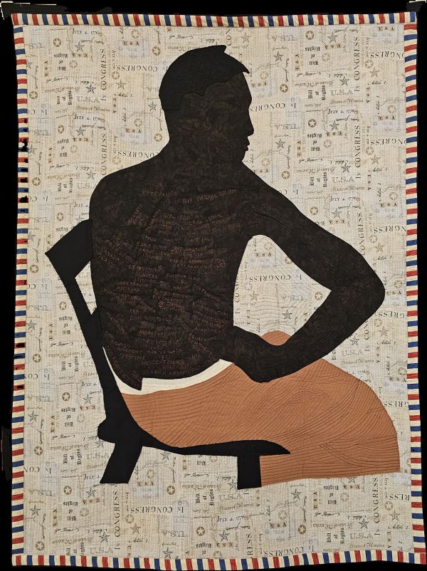 Deborah A Moore Harris - Peter aka Gordon: Retrospective (a quilt of a shirtless man's silhouette in a chair. there is writing on his back)