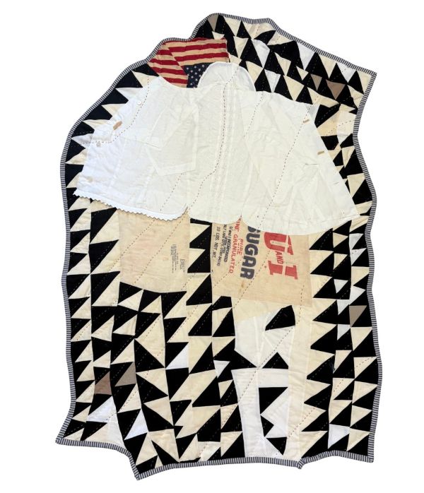 Adie Kleckner - The cloth holds the memory of the body (irregular shaped quilt with black and white triangles, segment of American flag, white and advertising fabric)