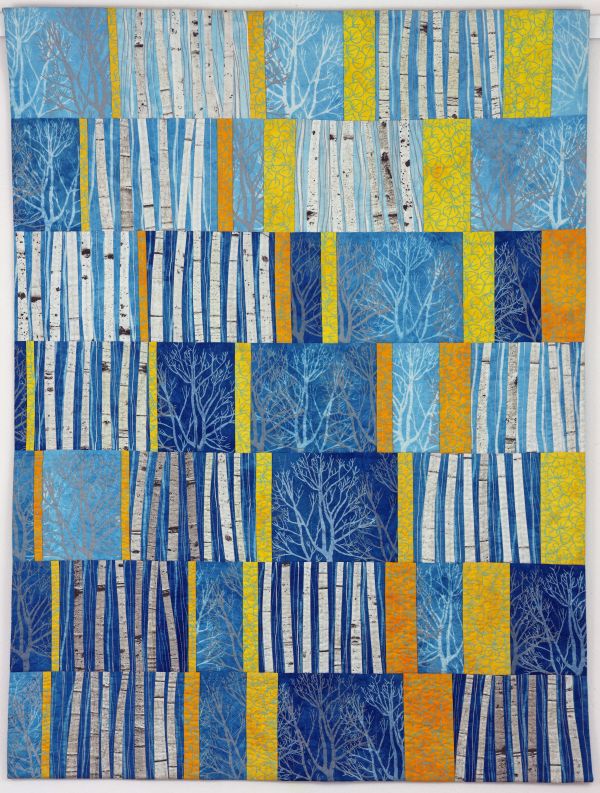 Brenda H Smith - Aspens 5 (a quilt made up of offset blocks that depict sections of aspen trees on blue background, interspersed with yellow strips)
