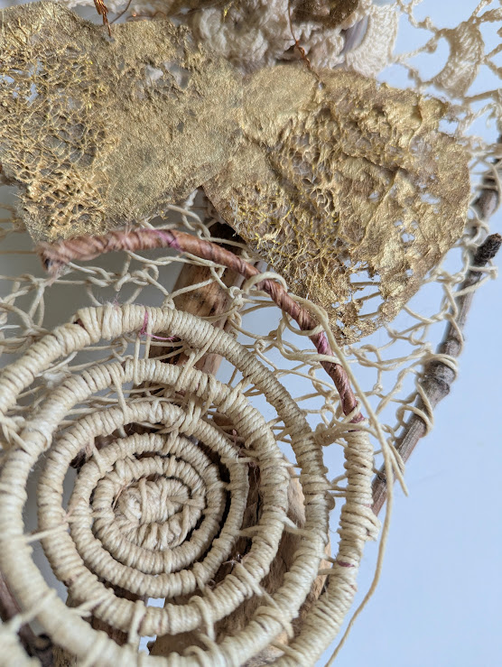 Sue Lewis - Becoming Undone (close up of fiber art, a spiral wrapped with cord)