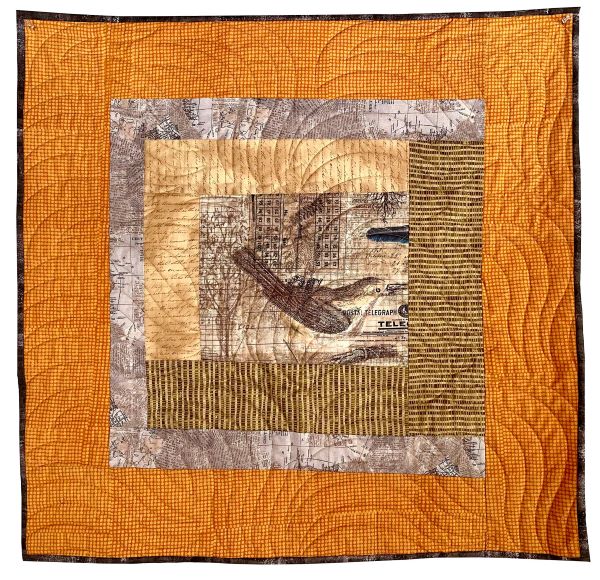 Sandra Teepen - Bird Type Map Collage (an orange quilt with text and a bird in the center)