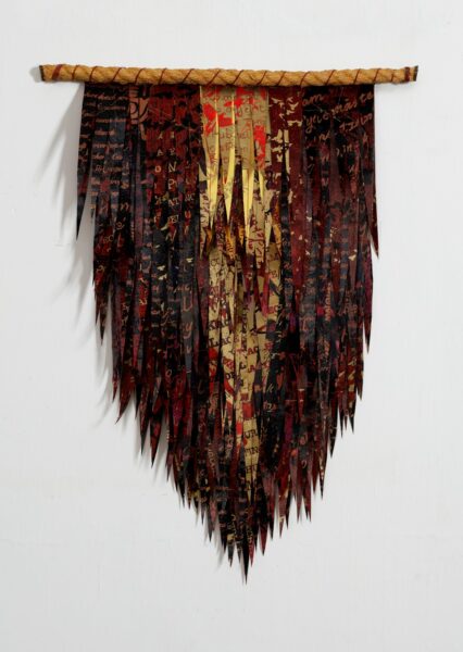  Deborah Kruger - Black Feather Triangle #1 (wall hanging of fabric strips suspended from a rod or rope in the shape of a wing)