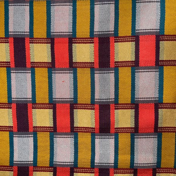 Brenda Gibson, "Interlacements", handwoven silk scarf a woven cloth in blue, yellow, and red squares