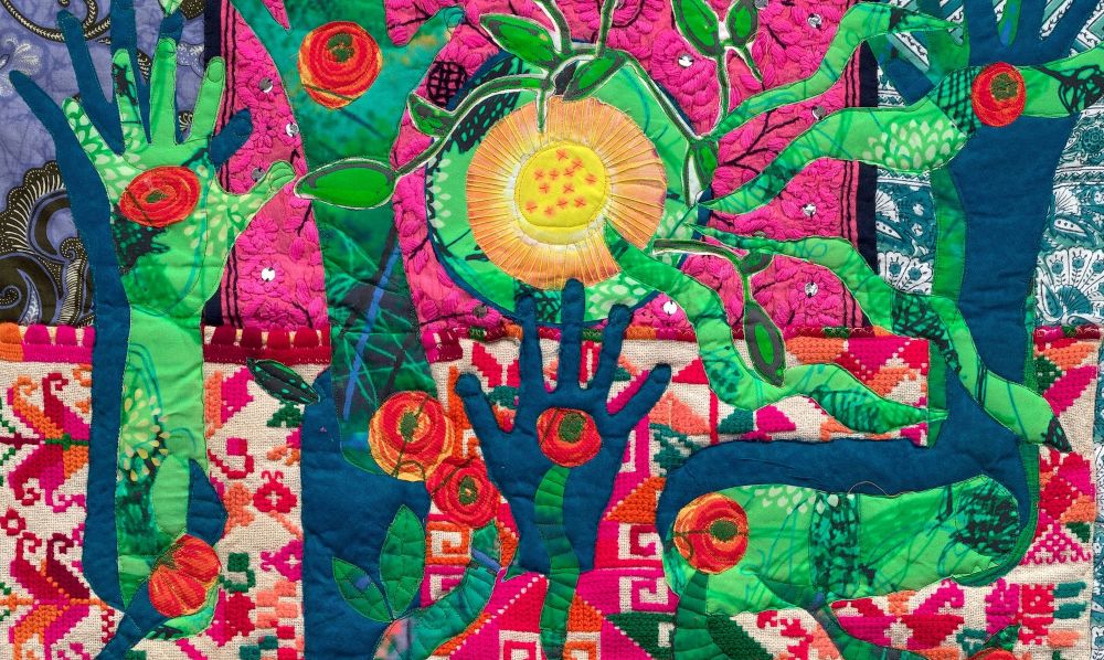 Susie Monday - Guardian of Self Worth, detail (a colorful quilt with hands and flowers)