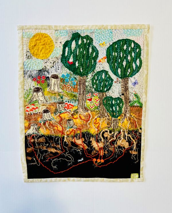 Susana Vizcarra - Beneath the Surface (a richly embroidered piece depicting a forest and root system. Many of the trees are cut down to stumps)