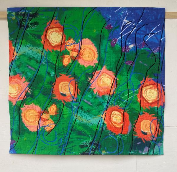 Susie Monday - Prickly Pear & Desert Wind (a quilt that is a close up take on a prickly pear cactus)