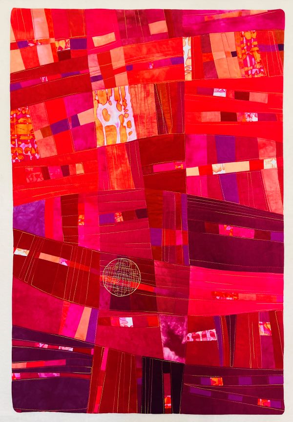 Anne Bellas - Final Aria (Quilt made of rectangles and shades of red, pink and orange.)