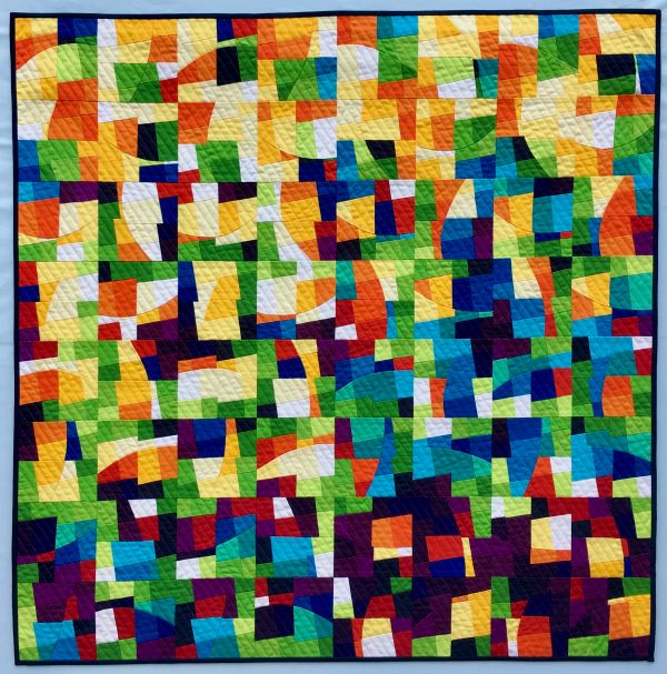 Alexandra Kingswell - Joy to the world (Colorful pieced quilt looks like stained glass with light streaming through)