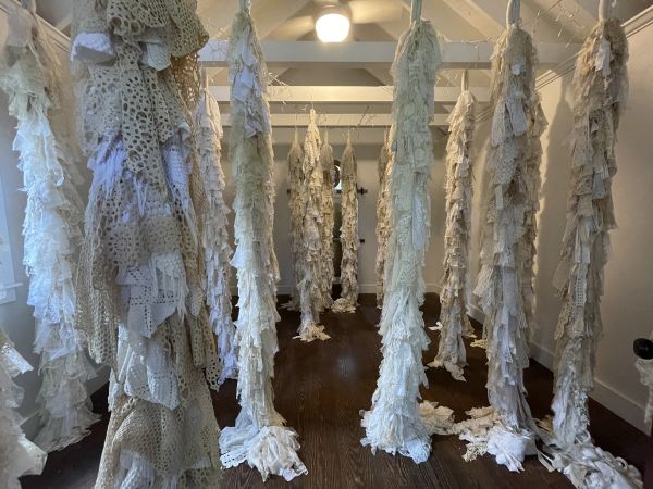 Susan Lenz - Lace Forest Installation (Large tree shapes made of doilies hang from the ceiling. They fill the room)