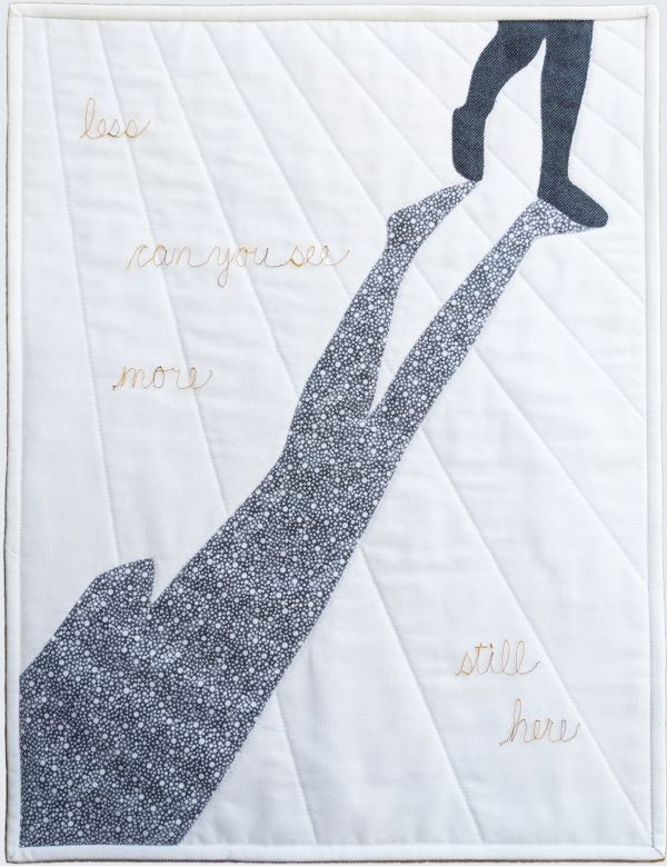 Lee McLean - Still Here (quilt with silhouette and shadow of legs walking. text reads less can you see more still here)