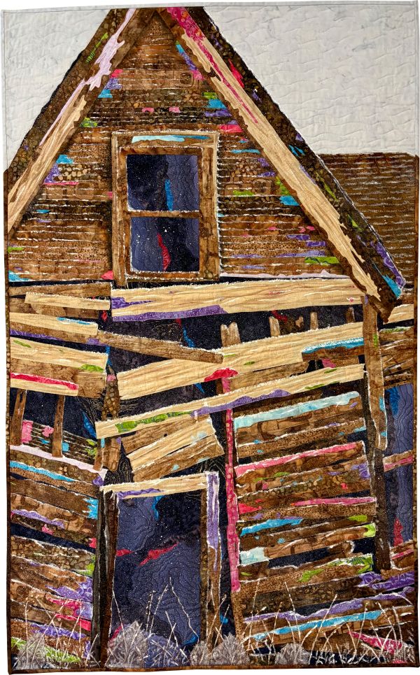 Michelle Jackson - Standing Alone (a quilt depicting a dilapidated house with bright colors peeking out from between the boards)