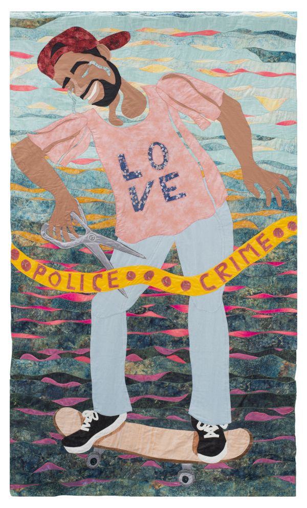 Jo-Ann Morgan - Tyre Nichols Memorial Skate Park (quilted portrait of a man on a skateboard. His shirt says LOVE and he is crying and cutting a ribbon that says "police crime". 