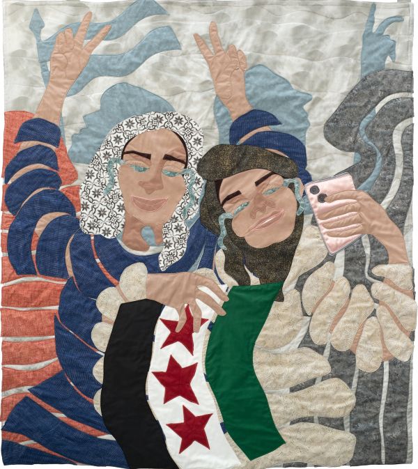 Jo-Ann Morgan - Fall of the Assad Regime (a quilted portrait of women crying and smiling while holding the Syrian flag and an iphone)