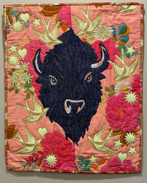 Audrey Hyvonen - Shield Maiden with Swallow Tail Signs (quilt portrait of bison on background of flowers and birds)