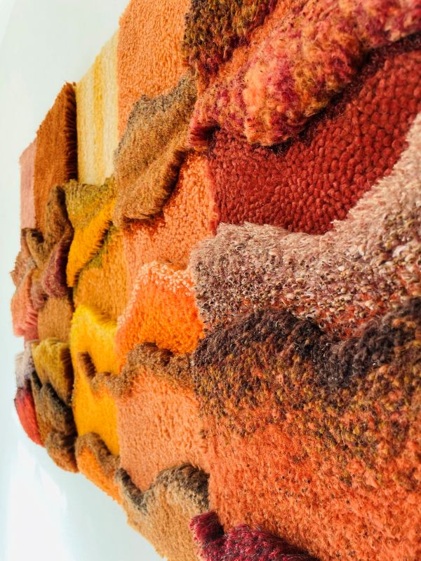 Marisa Wieland - Forgotten Billboards (close up of rug art in oranges and reds)