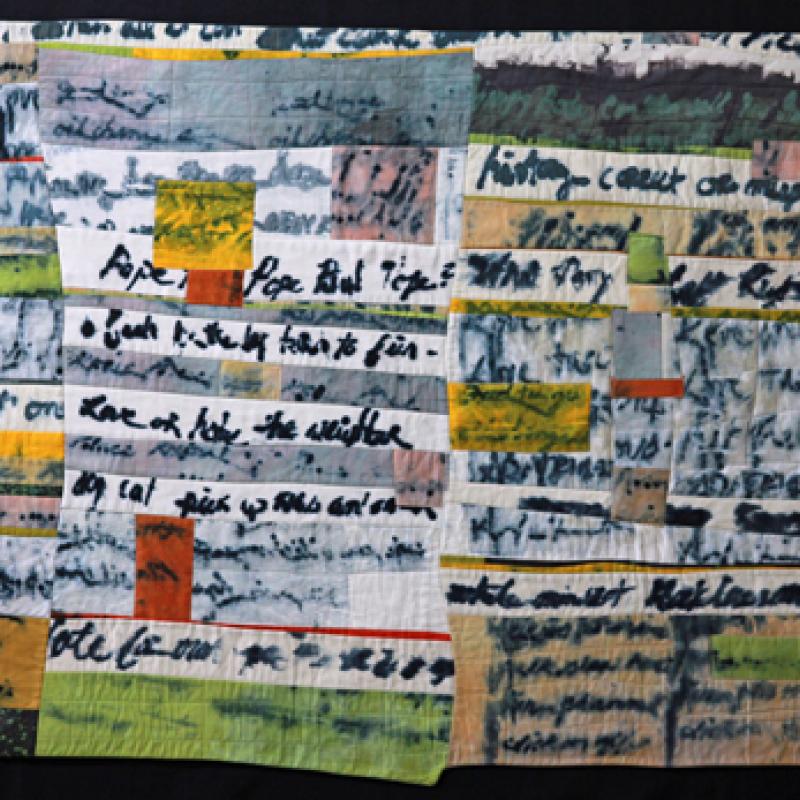 Colleen Ansbaugh - Lost Thoughts (a quilt made of strips with cursive handwriting on them)