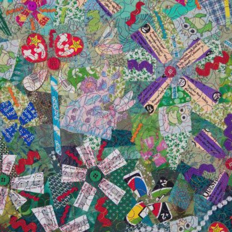 Pat Kroth - Plays The Thing (detail of an art quilt made from found objects and trash including beanie baby tags shaped into flowers)
