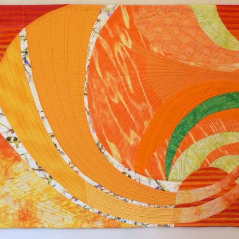 Nancy Bardach - California Dreaming (a quilt with orange swirls)