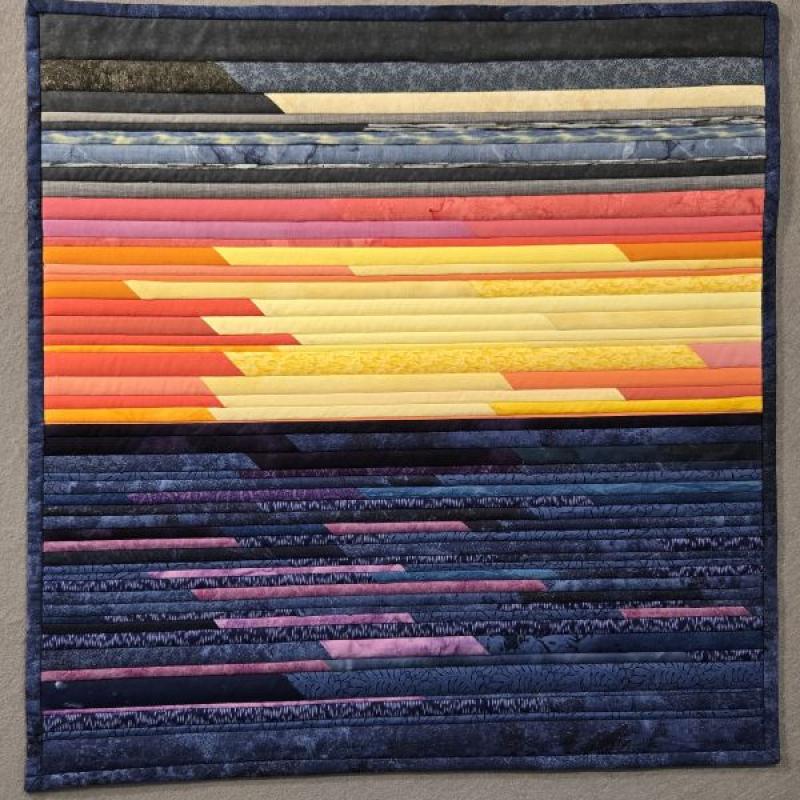  Joan Hug-Valeriote - Lake Huron Sunset (art quilt of abstracted sunset made of strips)