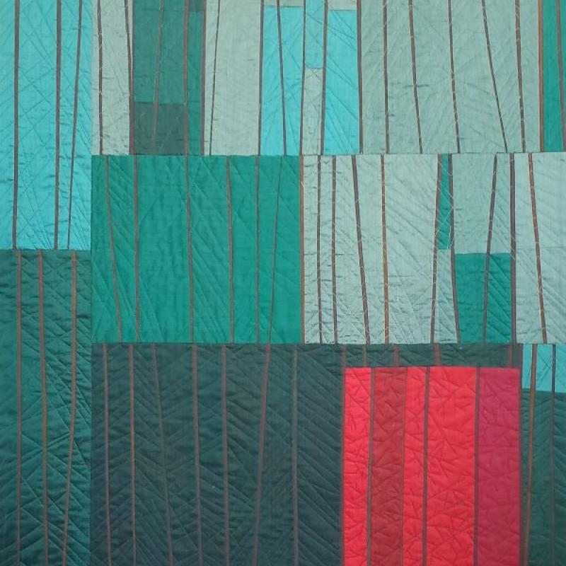 Rene Iannarelli - Fall Maple in the Pines (a quilt made from a series of teal rectangles with a pop of red rectangles at the bottom)