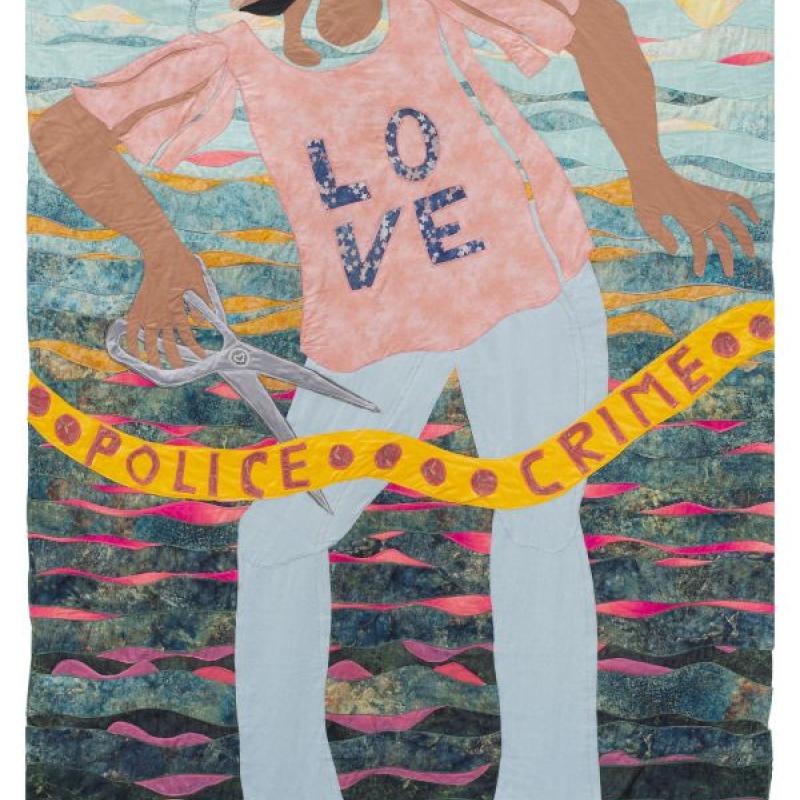Jo-Ann Morgan - Tyre Nichols Memorial Skate Park (quilted portrait of a man on a skateboard. His shirt says LOVE and he is crying and cutting a ribbon that says "police crime". 