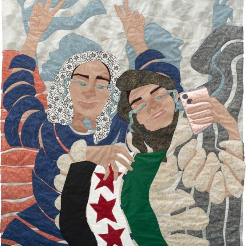 Jo-Ann Morgan - Fall of the Assad Regime (a quilted portrait of women crying and smiling while holding the Syrian flag and an iphone)