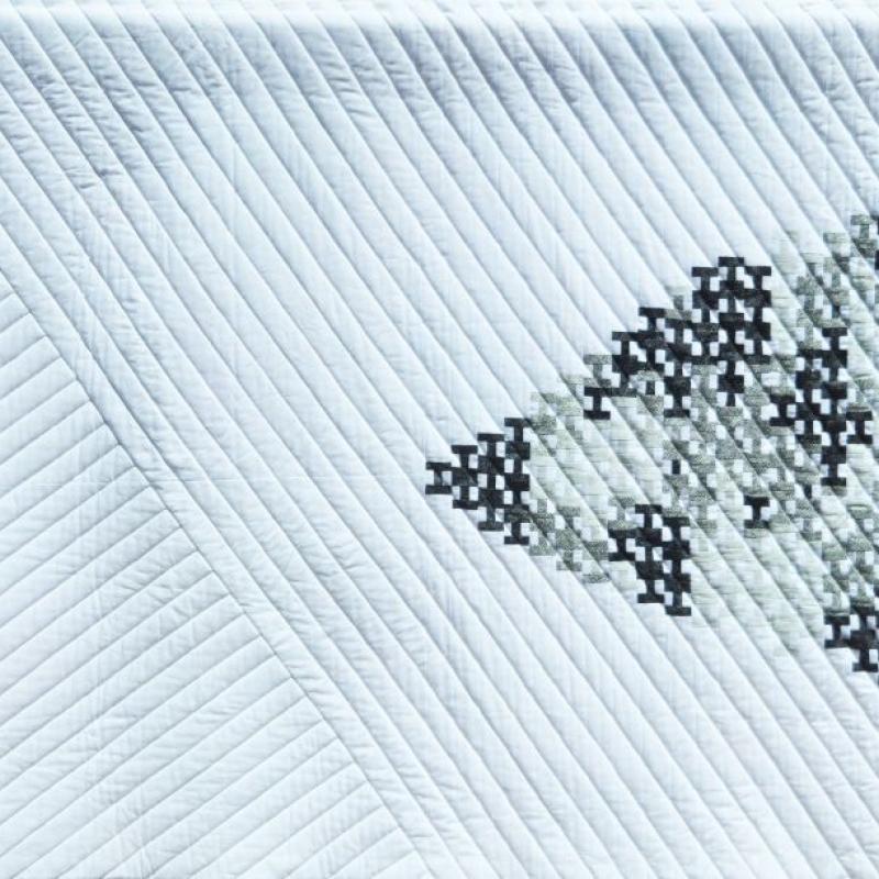 Shelley Koss - Nonconformist Goose (white background with diagonal quliting, black and white shapes form a triangle like a flock of geese)