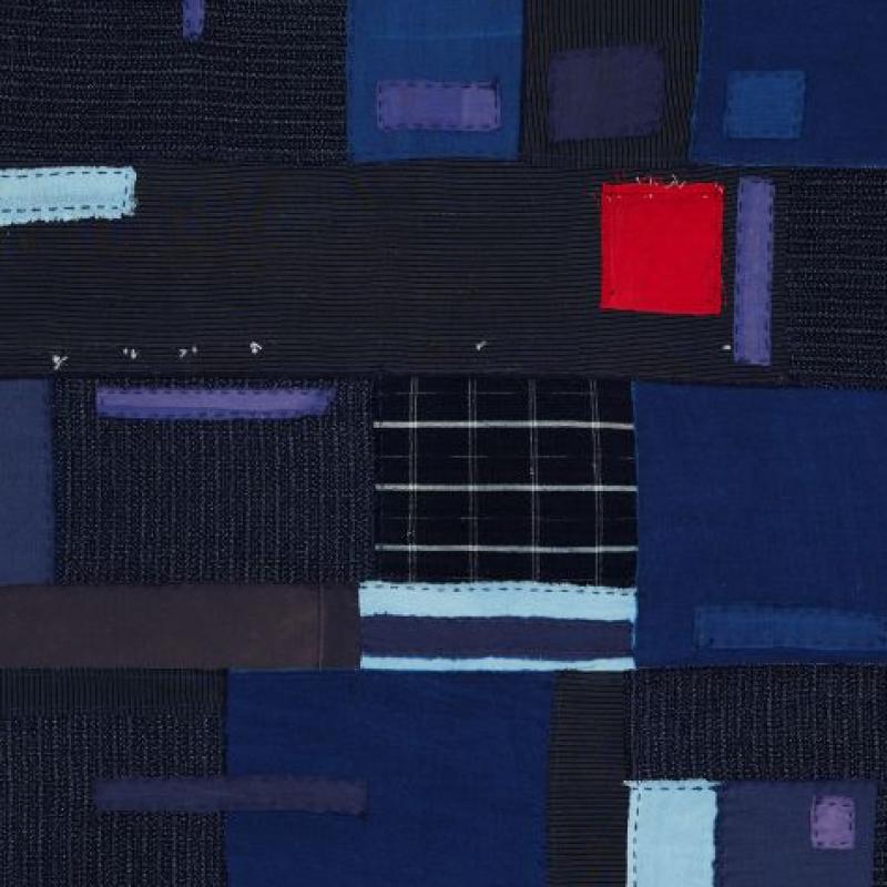 Alison Muir - recycled rags (a navy blue quilt with rectangles of blue and a pop of red)